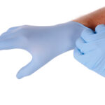 Doctor putting gloves